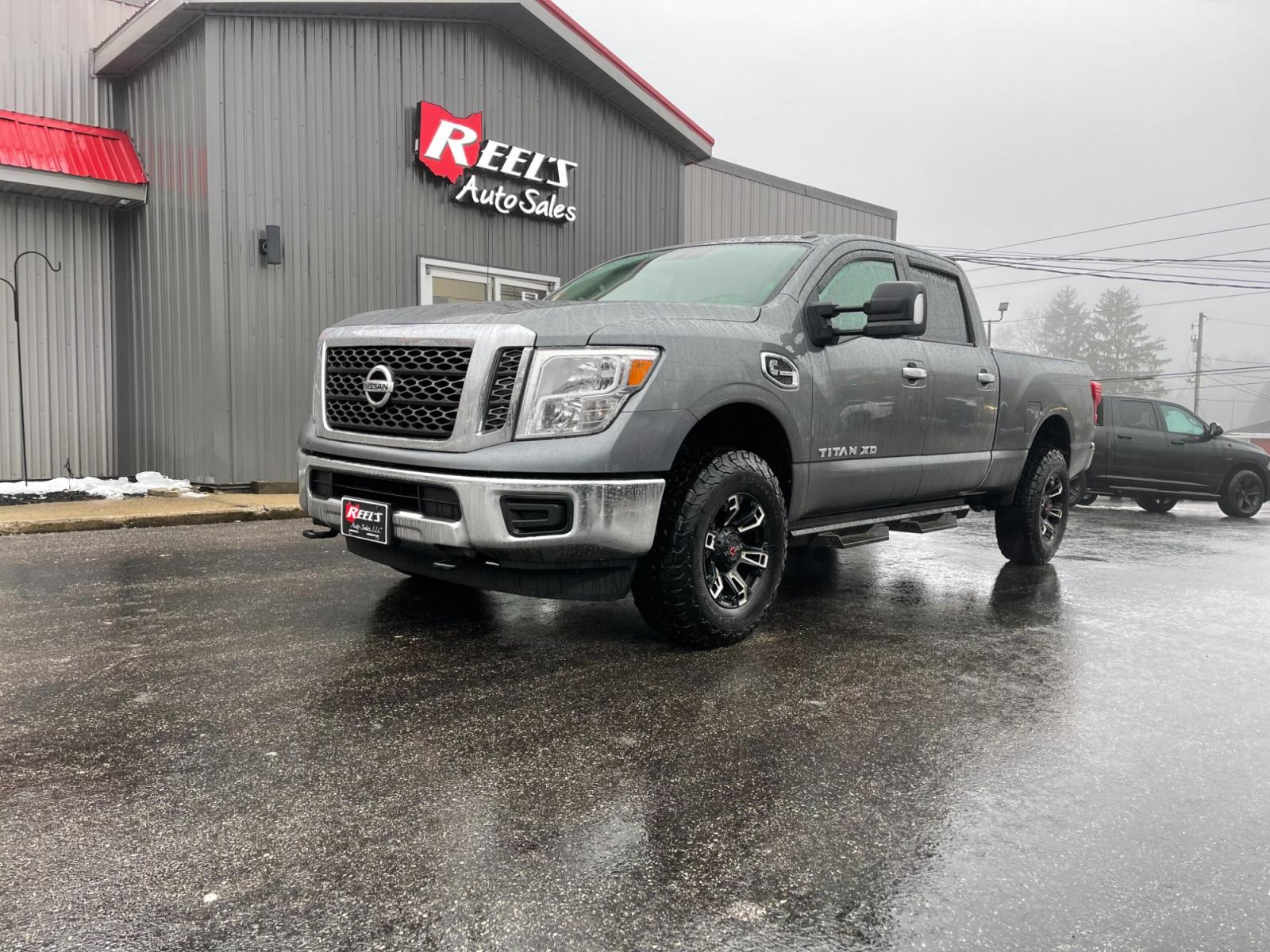 2017 Silver /Black Nissan Titan XD SV 4WD Diesel (1N6BA1F33HN) with an 5.0L V8 DOHC 32V DIESEL engine, 6A transmission, located at 11115 Chardon Rd. , Chardon, OH, 44024, (440) 214-9705, 41.580246, -81.241943 - This 2017 Nissan Titan XD SV Crew Cab featuring the 5.0 Cummins V8 diesel engine and a 6-speed Aisin transmission is a robust full-size pickup truck designed for heavy-duty tasks. As a one-owner vehicle, it suggests a potentially well-maintained history, and with a significant towing capacity of 12, - Photo #0